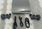 PS3 slim craquée avec 20 jeux et 2 manettes